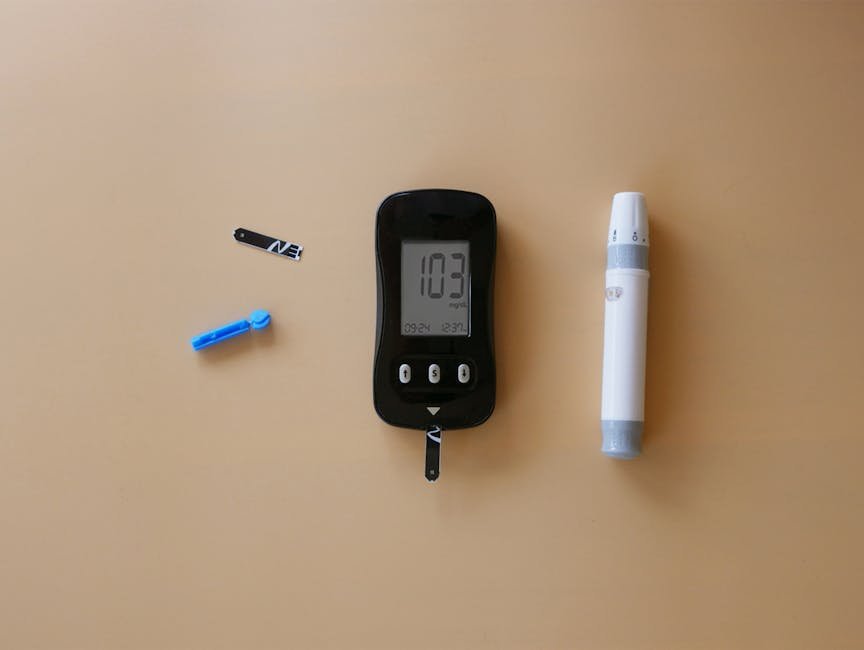 Medical tools for diabetes blood sugar testing on a beige background.