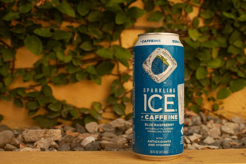 Blue Raspberry flavored sparkling water with caffeine and antioxidants in an outdoor setting.