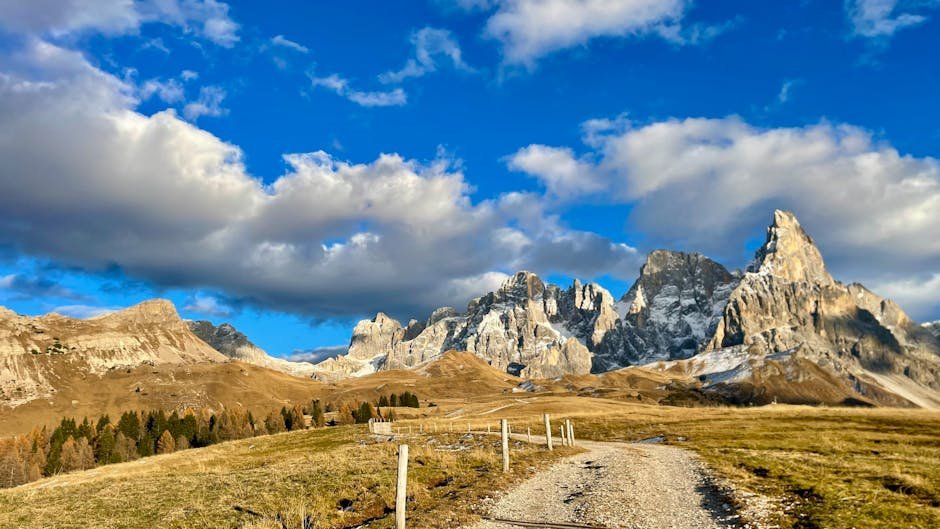 Breathtaking mountain view of Pale di San Martino in the Dolomites under a vibrant blue sky.