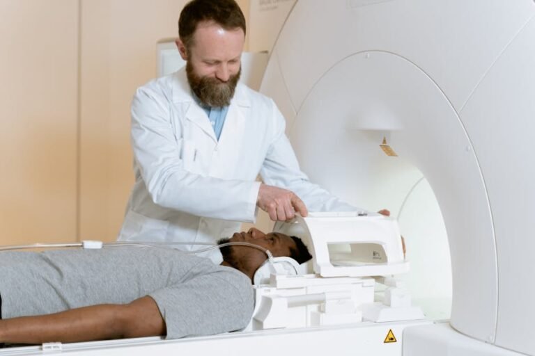 A medical professional assists a patient in an MRI scan. Focus on healthcare technology.