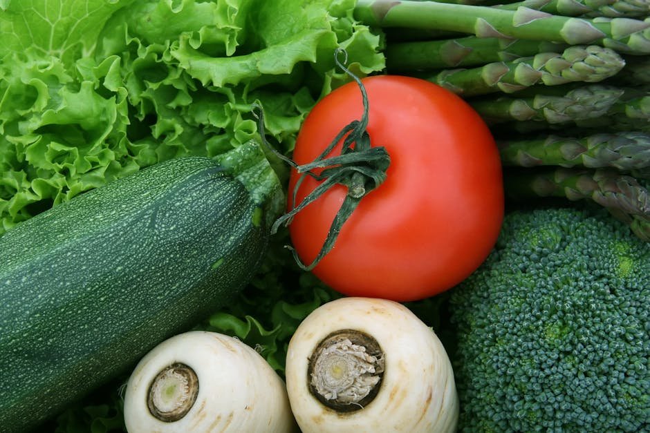A vibrant close-up of fresh vegetables, including tomato, zucchini, and broccoli, perfect for healthy eating imagery.