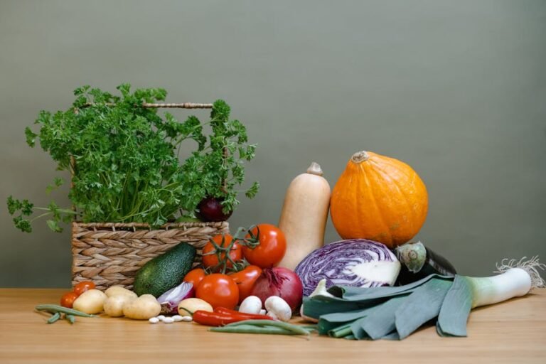 A vibrant display of fresh vegetables including tomatoes, squash, and parsley.